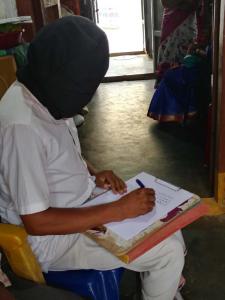 Mirror writing "Vandemataram" within 2.52 minutes while being blindfolded Photos